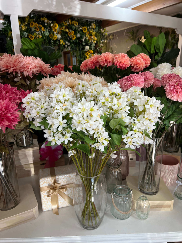 lilac flowers in glass vase