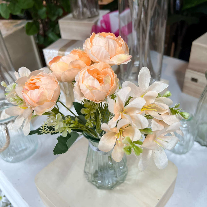 peach peonies in vase