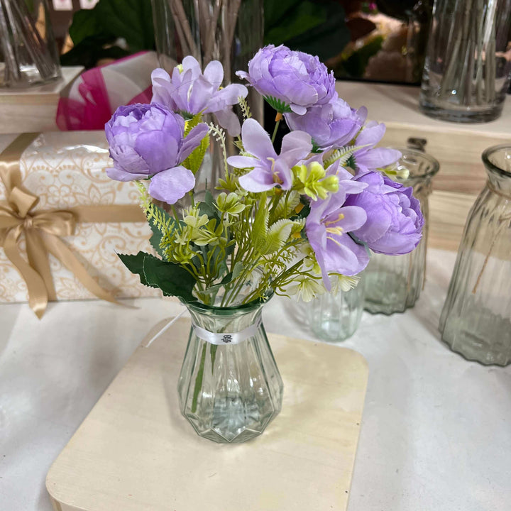 purple flowers in a glass vase